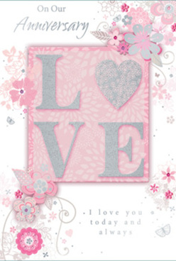 This anniversary card features a refined, romantic design that feels as serene as a peaceful walk near Hook's leafy lanes on a soft spring afternoon. Dominating the centre is the word "LOVE," boldly spelled in raised lettering that has been dusted with fine, frosted glitter, making each letter shimmer slightly as though lit from within. The glitter edging is subtle rather than flashy, giving the card a tactile richness that begs to be traced by hand. The background behind the word is a warm blush pink, deepening just enough to set off the letters like a soft spotlight. Surrounding this focal point, intricate illustrations of stylized flowers and slender leaves drift across the card, their outlines drawn in fine silver and pale grey with touches of blush and pearl. The blooms resemble lightly sketched roses and small garden blossoms, arranged much like a florist might plan an anniversary bouquet in a studio near Hook station: balanced, airy, and full of quiet grace. Gentle swirls and looping vines weave between the flowers, creating a flowing frame that guides the eye without overpowering the message. Additional text in an elegant script, including heartfelt anniversary sentiments, rests harmoniously within the design, as if handwritten with care. The card feels softly luminous, as though bathed in diffused morning light, and its colour palette of pearly whites, powder pinks, and silvery greys creates an atmosphere of intimacy and tenderness. It evokes the fragrance and delicacy of fresh flowers delivered to a doorstep in Hook, perfectly suited to celebrating a long-nurtured love story.